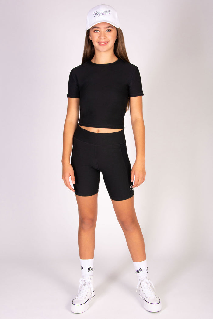 Black cycling shorts in rib fabric designed for high impact workouts.
