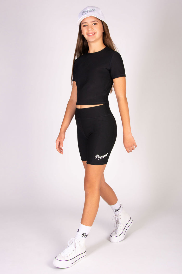 Black cycling shorts in rib fabric designed for high impact workouts.