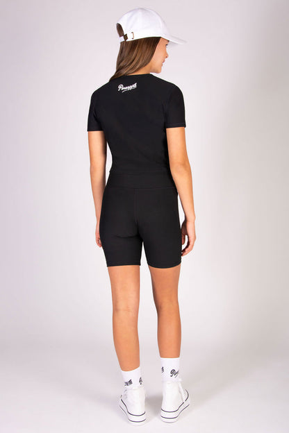 Girls' black cycling shorts in rib fabric designed for high impact workouts.