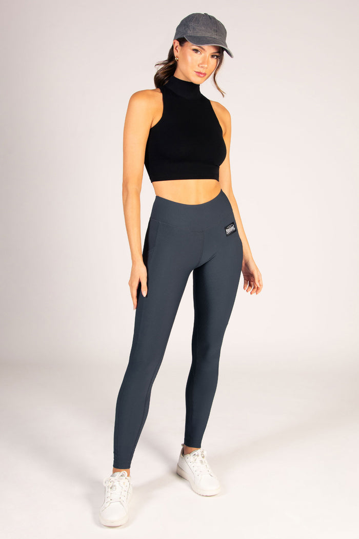 Women's dark grey rib leggings featuring two concealed side pockets, wide elasticated waistband and side stitching.
