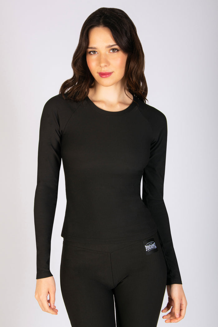 Women's black tight long sleeve gym top in black designed to support you during high impact workouts.