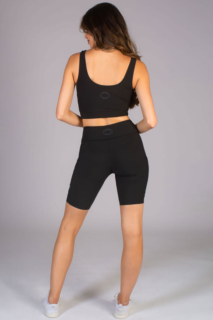 Survival of the fittest logo feature on black matching seamless gym set for women