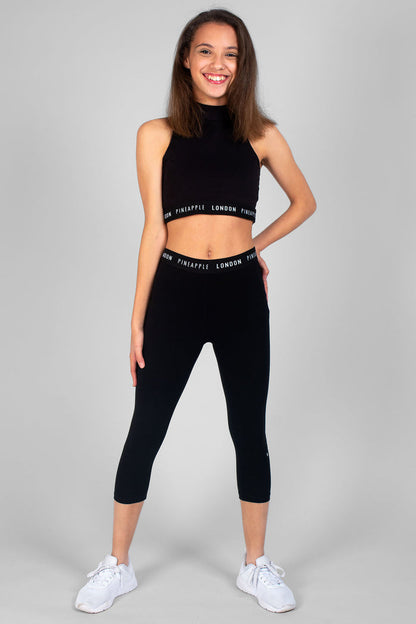 Girl wearing black Script Crop Leggings and black crop top