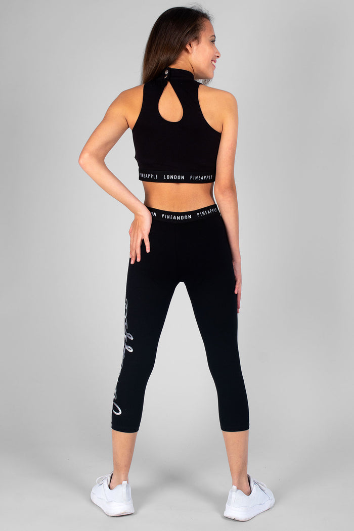 Girl wearing black Crop Leggings and black Barbarella Crop Top