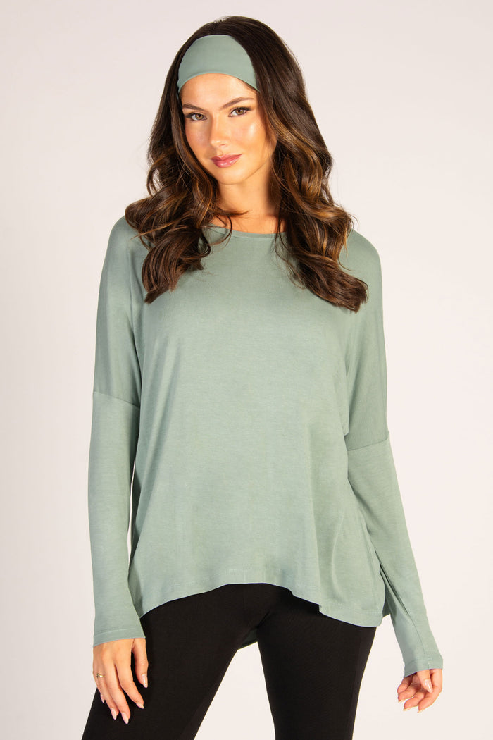 Women's viscose long sleeve top in sage with dipped back, a super soft fabric that fits all shapes.