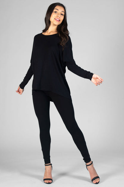 Woman wearing black Logo Long Sleeve Top and black leggings