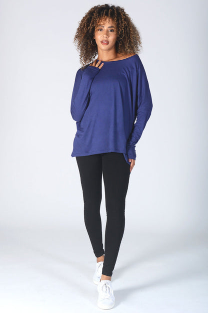 Woman wearing wide neck navy Script Long Sleeve T-Shirt and black leggings