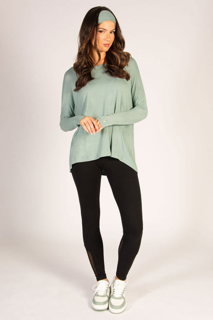 Light green along sleeve top in soft viscose fabric, featuring a tight sleeve but loose, dipped back.