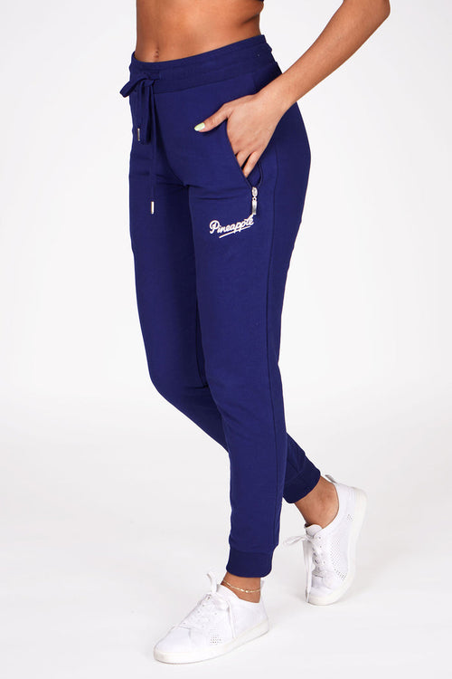 Woman wearing Pineapple Navy Skinny Zip Trousers