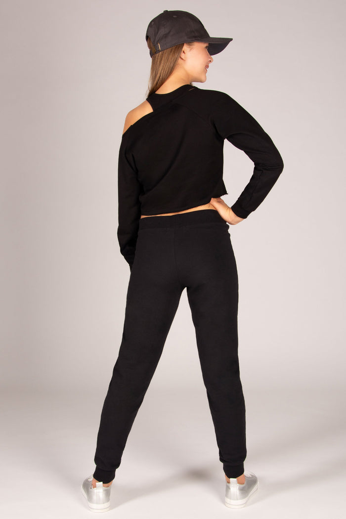Girls' black skinny zip joggers paired back with off-shoulder sweater