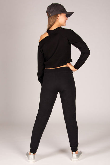 Girls' black skinny zip joggers paired back with off-shoulder sweater