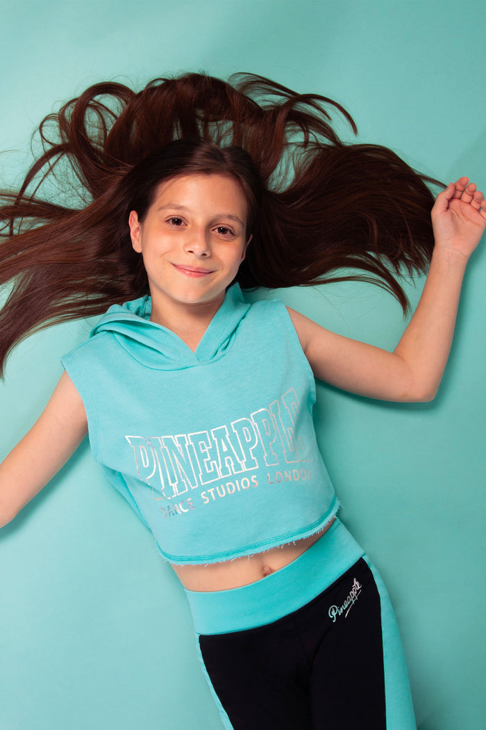 Sleeveless hoodie for girls in turquoise colour way featuring a Pineapple Dance logo print