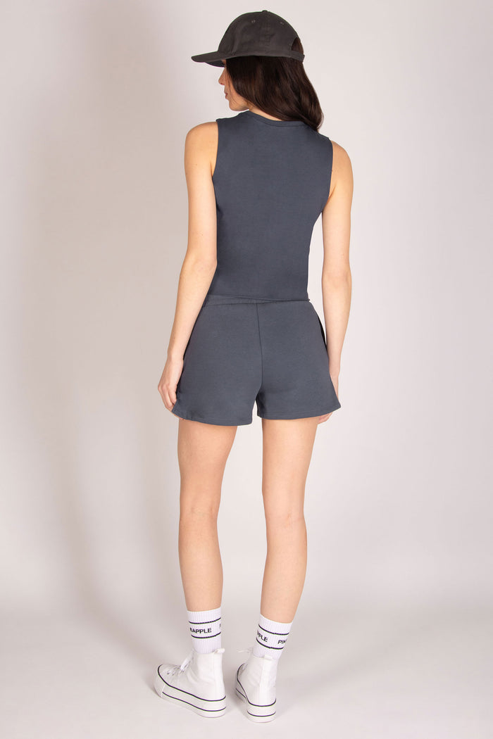 Women's charcoal sleeveless crop vest paired with matching sport shorts and club socks.