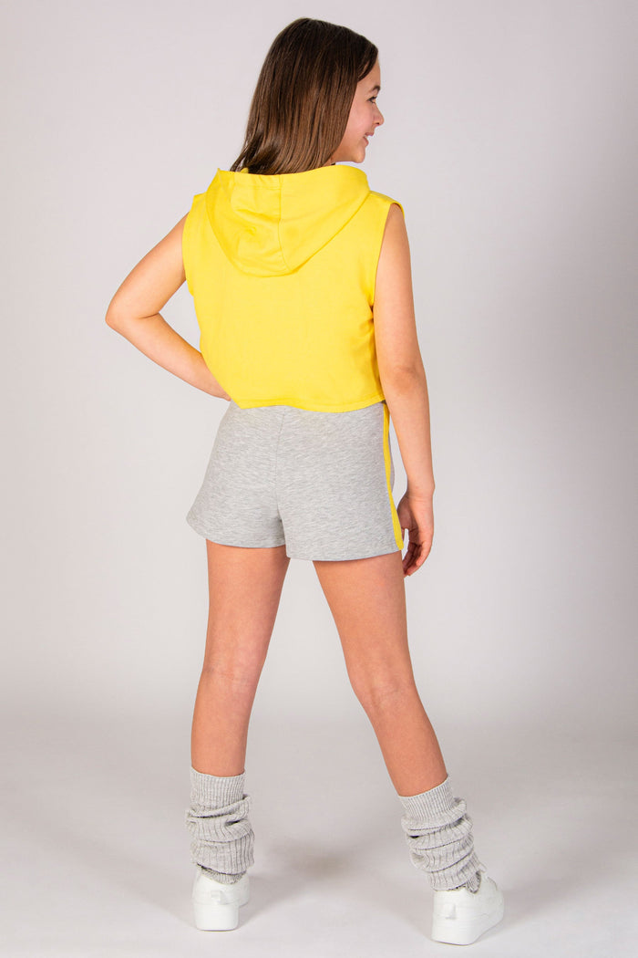 Girls' ultimate easter dance outfit complete with sleeveless crop hoodie in yellow and marl grey sweat shorts by Pineapple Dance Studios.