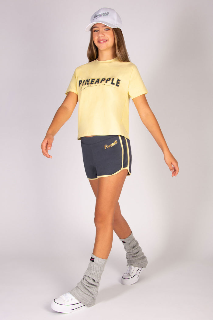 Kids' sporty shorts in dark grey wpaired with butter yellow t-shirt