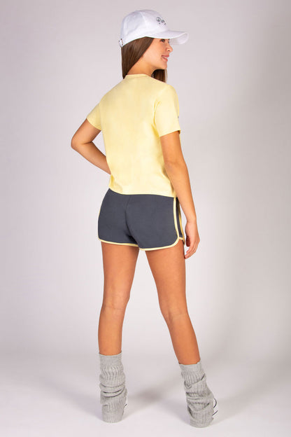 Teen's sporty shorts with butter yellow side panels paired with butter yellow t-shirt