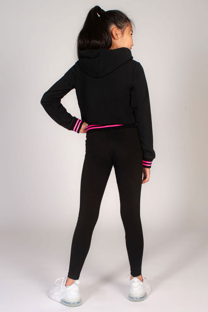 Basic black leggings for kids with neon pink stripe rib band and dance print on hip.