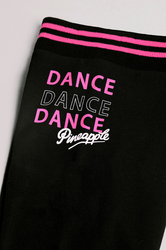 Detailed shot of Pineapple Dance hip print on these basic dance leggings for girls.