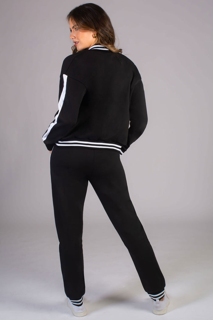 Women's black joggers with stripe rib cuff paired with matching Pineapple unisex bomber jacket