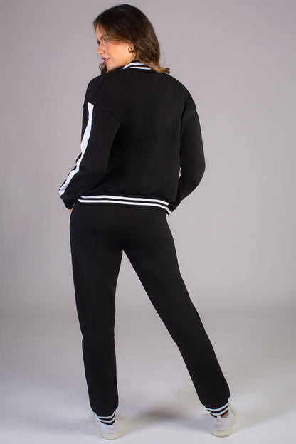 Women's black joggers with stripe rib cuff paired with matching Pineapple unisex bomber jacket
