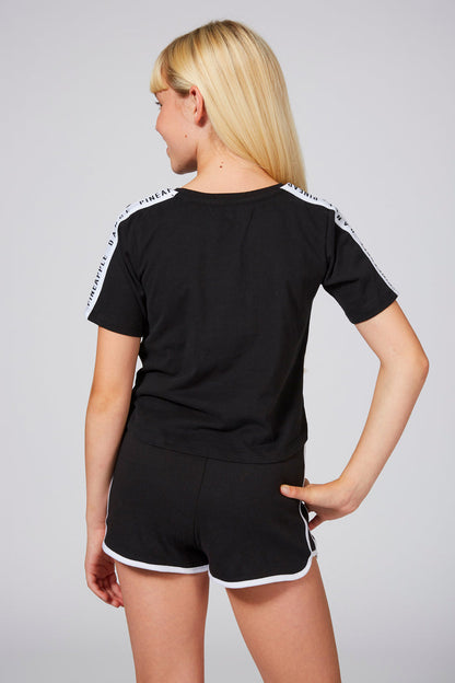 Girl wearing Pineapple Logo Black Shorts with Contrast Stripes, Piping