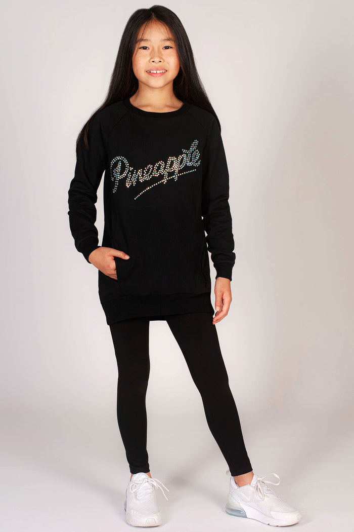 Girls' black oversized sweater with sparkling studs across the chest.