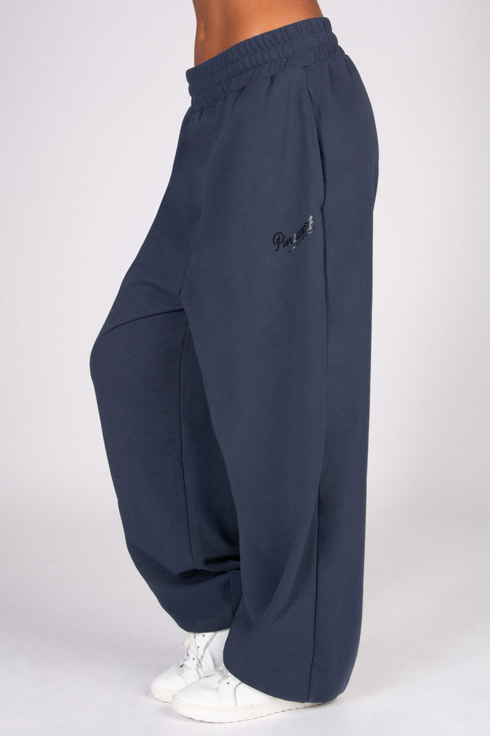 Navy blue boyfriend joggers on a white background
