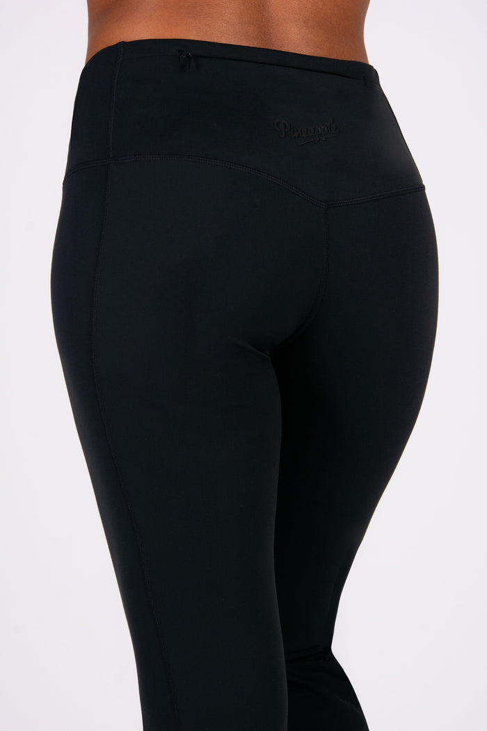 Black yoga trousers with concealed zip pockets on the back