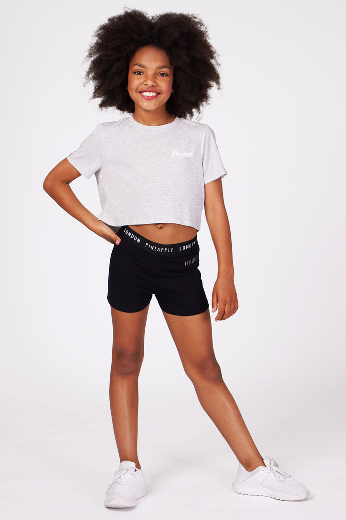 Girl wearing Black Jacquard Hot Pants with grey crop top