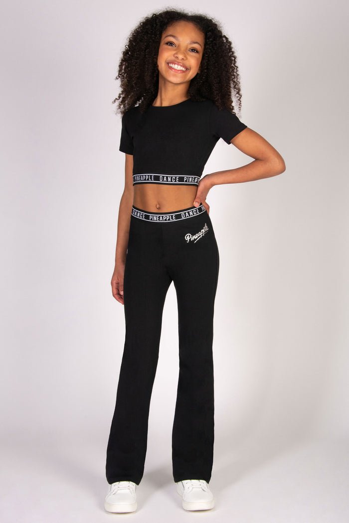 Girls' monochrome dance outfit with cropped fitted t-shirt and matching flared trousers