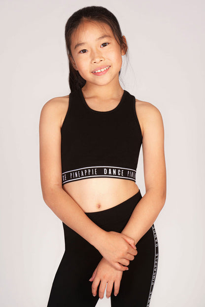 Girls' black crop top in stretchy fabric for sporty activities