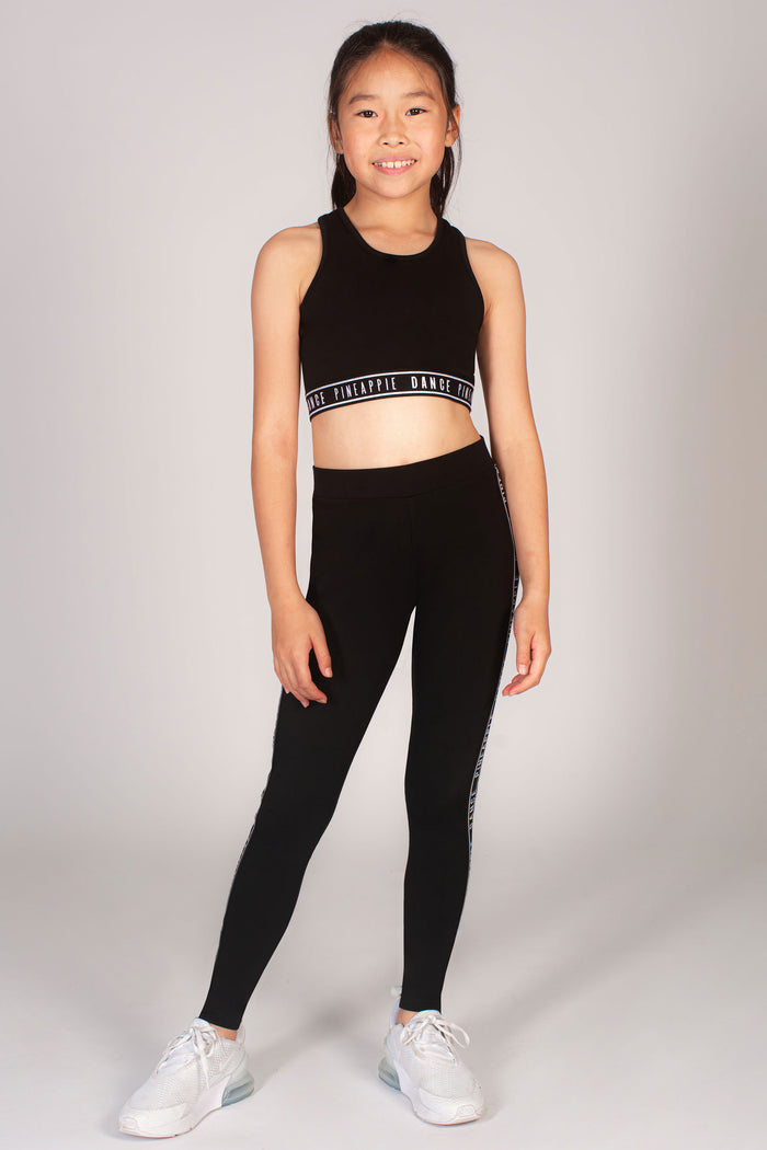 Black crop top in stretchy breathable fabric for girls designed by Pineapple Dance Studios
