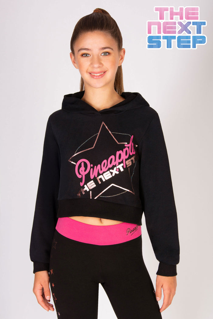 girl's black The Next Step hoodie with large TNS logo with diamantés.