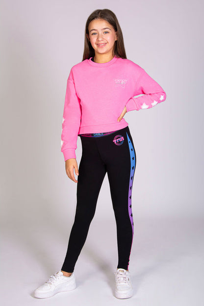 Pineapple x The Next Step sweater in pink for girls with diamanté and stars along the sleeves.