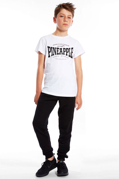 Boy wearing white Unisex Dance T-Shirt and track pants