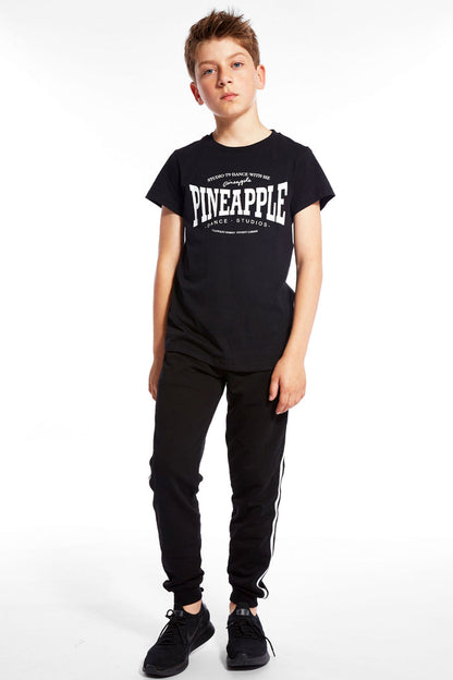 Boy wearing black Unisex Dance T-Shirt and black track pants