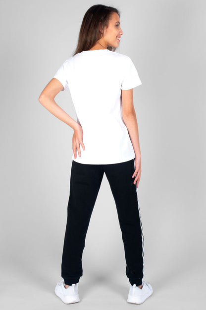 Girl wearing white Unisex Dance T-Shirt and black Unixex Joggers