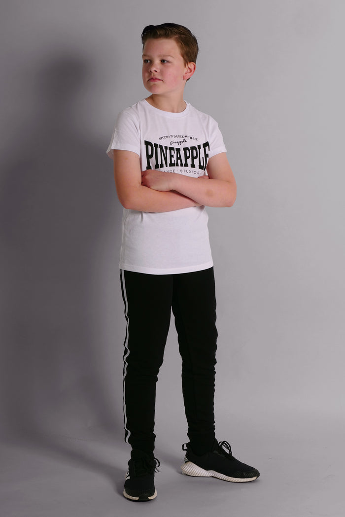 Boy wearing Black Unisex Kids' Stripe Joggers and white Unisex T-Shirt