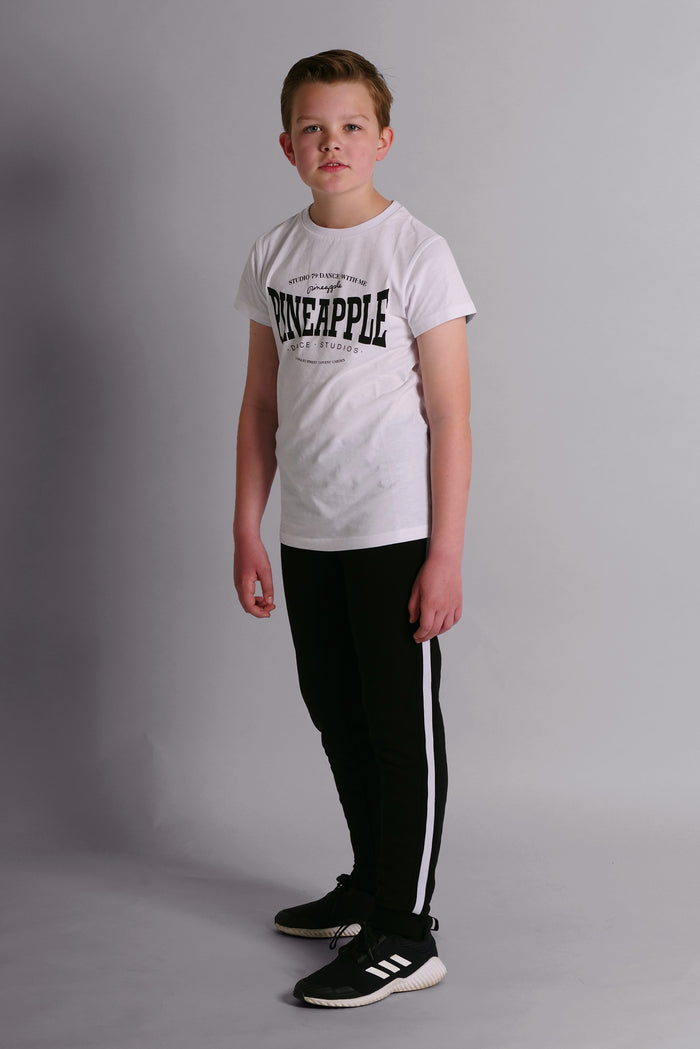 Boy wearing Black Unisex Kids' Stripe Joggers and white t-shirt