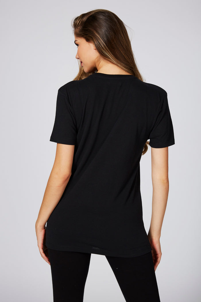 Woman wearing Unisex Black T-Shirt with white logo