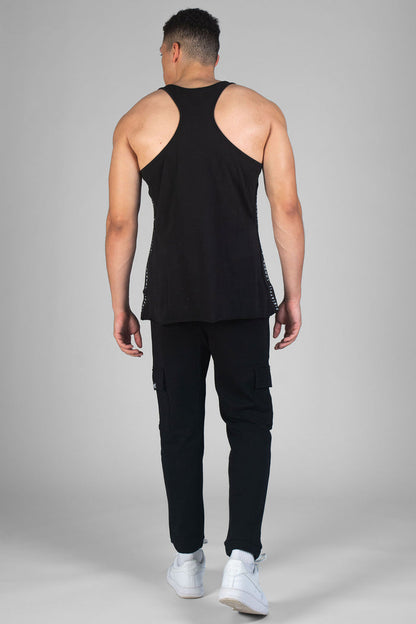 Man wearing black Unisex Vest and black cargo trackpants