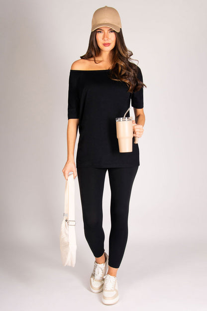 Women's black soft jersey top with short sleeves and loose fit, perfect for casual days