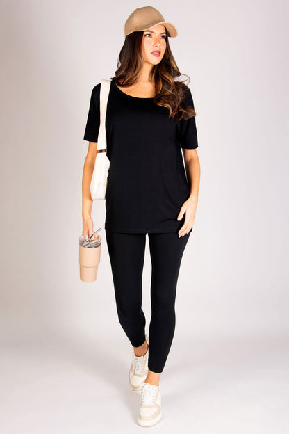 Black off shoulder short sleeve top made out of soft jersey fabric.