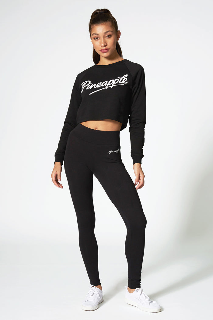 Kaory Desole modeling for Pineapple Dance Studios wearing black leggings and dance long sleeve top