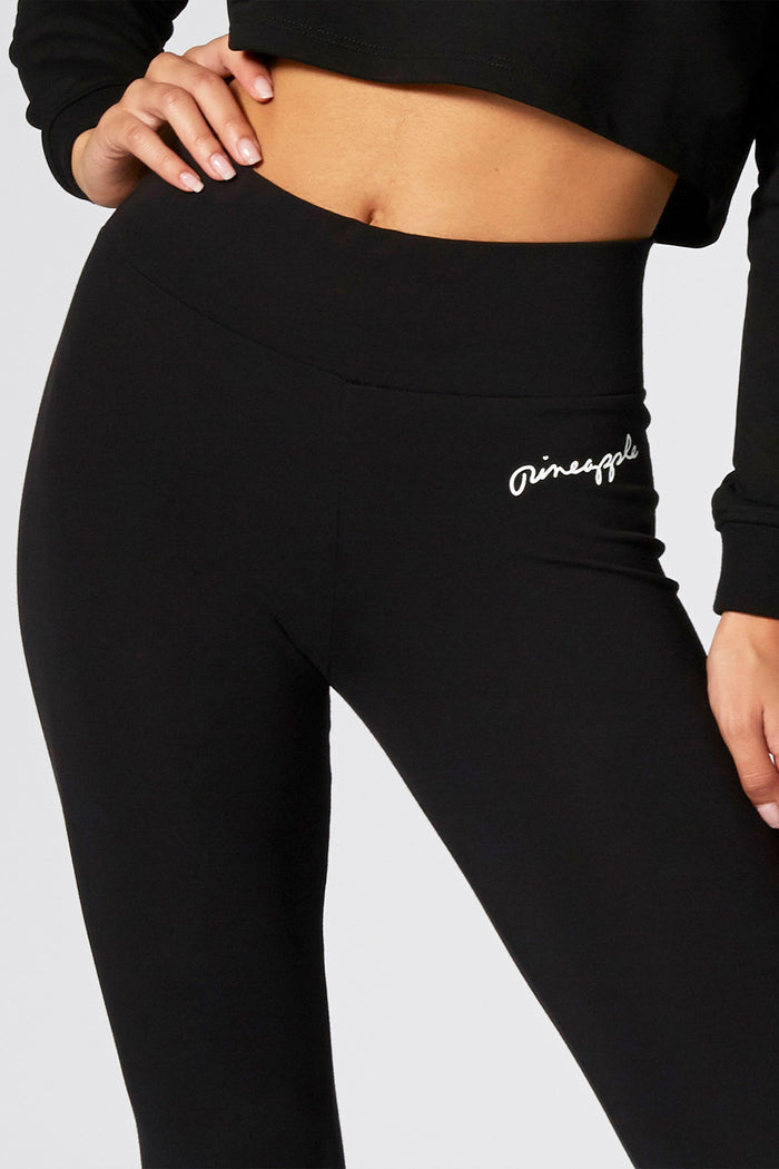 Black dance leggings with strong elasticated waistband and delicate hip logo on the left.