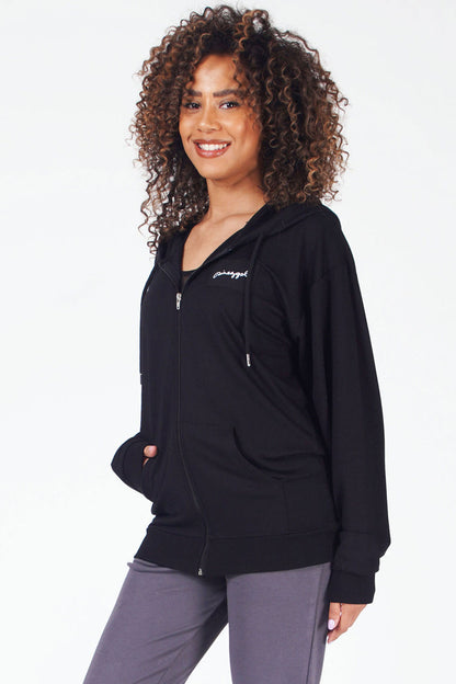 Woman wearing black zip front hoodie