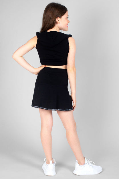 Girl wearing black Zip Skater Skirt with logo hem and black Sleeveless Hoodie